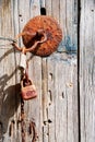 Old rusty wooden door with padlock Royalty Free Stock Photo