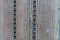 An old, rusty, worn chain hangs on the doors of a bicycle repair shop. Wood texture. Bicycle chain on wooden background Royalty Free Stock Photo