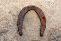 Old rusty and worn horseshoes  on white with natural shadows Royalty Free Stock Photo