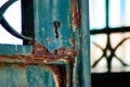 Old rusty and worn out lock where you can see the key hole