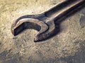 Old rusty wrench close-up in vintage style Royalty Free Stock Photo