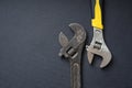 Old rusty wrench and new chrome wrench Royalty Free Stock Photo