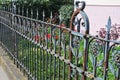 Old rusty wrought iron fence at a garden Royalty Free Stock Photo