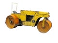 Old rusty yellow road roller isolated over white