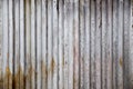 Old rusty zinc plate, vertical pattern on old metal sheet for vintage background. Grey dirty texture Royalty Free Stock Photo