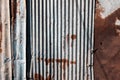 Old and rusty zinc sheet wall. Vintage style metal sheet roof texture. Pattern of old metal sheet. Rusting metal or siding. Royalty Free Stock Photo