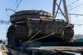 Old tank with artisanal reactive armor on a railway flatcar Royalty Free Stock Photo