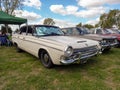 Old 1960s Chrysler Valiant III four door sedan on the lawn