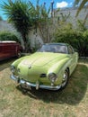 Old 1960s VW Karmann Ghia coupe in a park. CADEAA 2023 classic car show. Sunny day