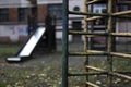 Old sad fall empty playground in the yard