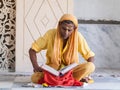 Old sadhu reading scriptures Royalty Free Stock Photo