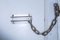 Safety chain lock on door Royalty Free Stock Photo