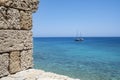 Old Sailboat on the Mediterranean Sea Seen from the Wall of Medieval Town of Rhodes Greece Royalty Free Stock Photo