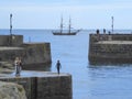 Old sailing ship at harbour entrance Royalty Free Stock Photo