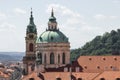 Old Saint Nicholas church with clock tower in Prague, Czech Republic. Cityscape view of Prague old town, high view point Royalty Free Stock Photo