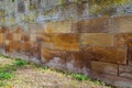 Old sandstone wall with colorful lichen and moss for background Royalty Free Stock Photo