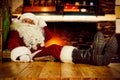 Old Santa Claus sitting in old throne chair in home interior and wooden table top with free space for your decoration. Royalty Free Stock Photo