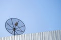 Old satellite dish on the blue sky background Royalty Free Stock Photo