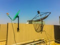 Old satellite dishes on concrete deck top roof floor of the old Royalty Free Stock Photo