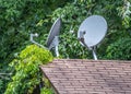 Old satellite dishes on a roof Royalty Free Stock Photo