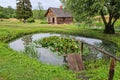 Old sauna and pond in Turaida, Latvia Royalty Free Stock Photo