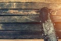 Old saw over a wooden boards background with space for tex Royalty Free Stock Photo