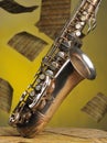 Old saxophone and flying musical notes on a backgr Royalty Free Stock Photo