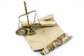 Old scales and documents stands on a blank sheet of paper, isolated on a white background. Space for text Royalty Free Stock Photo