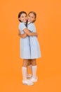 Old school. kid fashion. happy friends embrace on yellow background. fashion beauty. childhood happiness. sisterhood of