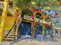 An old school old style 1950 1960 1900s asian vietnam restaurant small shop with tree branch and colorful lantern