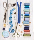 Old scissors, buttons, threads, measuring tape and sewing supplies Royalty Free Stock Photo
