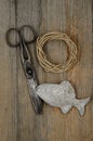 Old scissors, glasses, fish and hank of packthread Royalty Free Stock Photo