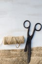 Old scissors, skein jute twine and burlap. Royalty Free Stock Photo