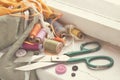 Old scissors, spools of thread, fabric and buttons.
