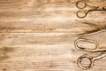 Old scissors on wooden background. Royalty Free Stock Photo