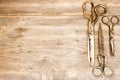 Old scissors on wooden background. Royalty Free Stock Photo