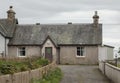 Old scottish house painted pink with a purpe door Royalty Free Stock Photo