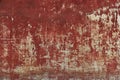 Old scratched and damaged red wall texture.