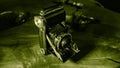 Old scratched and dusty antique photo camera, with foldable original Carl Zeiss Lens, on a rustic wooden table.