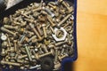 Old screws in a box. a lot of various screws. pile of fasteners in the box close up. carpentry workshop. working tool Royalty Free Stock Photo