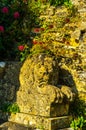 Old sculpture on the pedestal, beautifully preserved old artistic figure, decorative elements on the outside Royalty Free Stock Photo