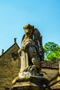 Old sculpture on the pedestal, beautifully preserved old artistic figure, decorative elements on the outside Royalty Free Stock Photo