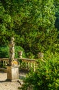 Old sculpture on the pedestal, beautifully preserved old artistic figure, decorative elements on the outside, vintage Royalty Free Stock Photo