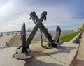 Old sea crossed anchors on the background of Peter's harbour. Kronstadt, St. Petersburg, Russia