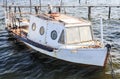 Old sea fishing boat in the water at the pier Royalty Free Stock Photo