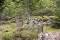 Old semetery in Finland with grave crosses and stones