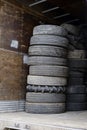 Old semi truck tires are piled in pile in semi trailer Royalty Free Stock Photo