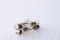 Old semiconductor transistors from Soviet technology on a white background Royalty Free Stock Photo