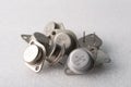 Old semiconductor transistors from Soviet technology on a white background Royalty Free Stock Photo