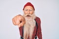 Old senior man with grey hair and long beard wearing hipster look with wool cap pointing displeased and frustrated to the camera, Royalty Free Stock Photo